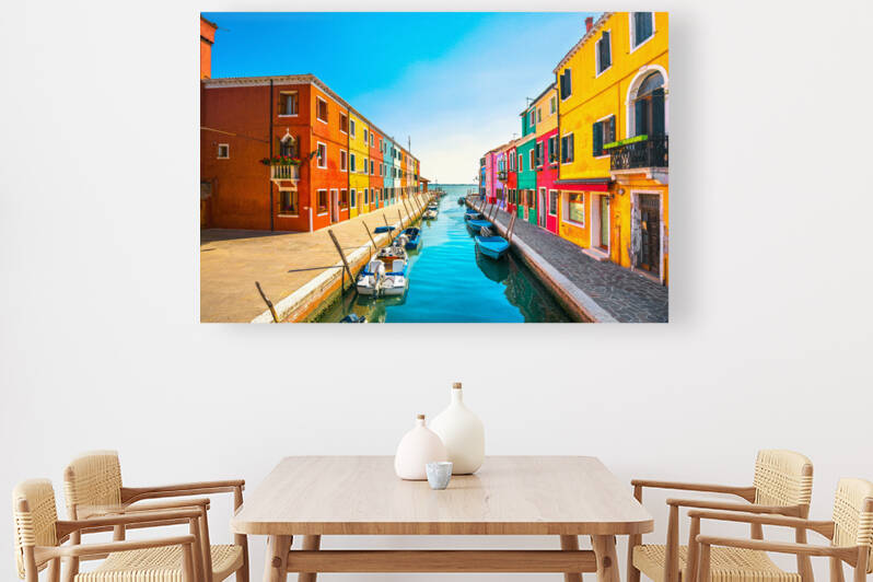 Burano island. Colorful houses and boats in the canal by Stefano Orazzini
