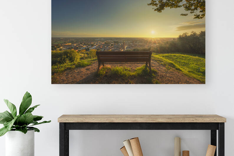 Bench and Pietrasanta town view at sunset. Italy by Stefano Orazzini