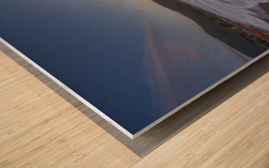 Waves on the Baratti beach at sunset. Tuscany Italy Wood print