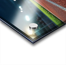 View of a well lit athletic track at night showcasing vibrant red surface and brightly illuminated surroundings Acrylic print