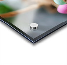 A cute kitten sits amidst Easter eggs in a basket. Acrylic print