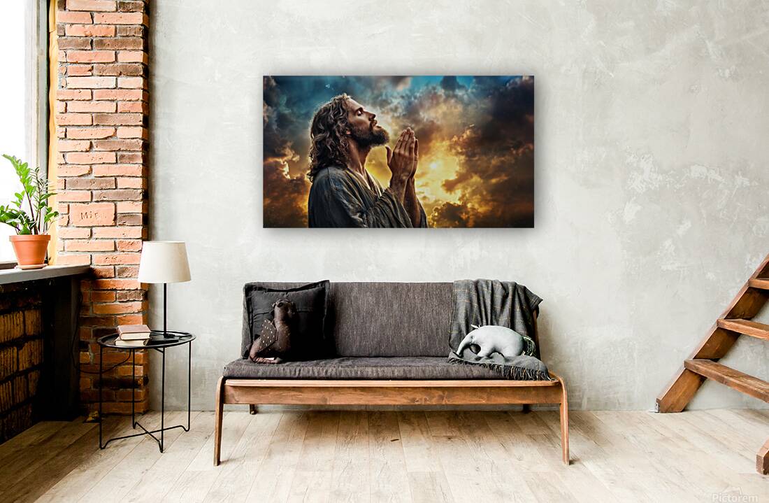 Spiritual reflection at sunset with Jesus Christ in prayer amidst dramatic clouds Reproduction