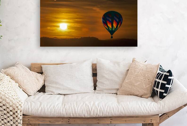 Sunset with hot air balloon in sky by Daniel L Friend