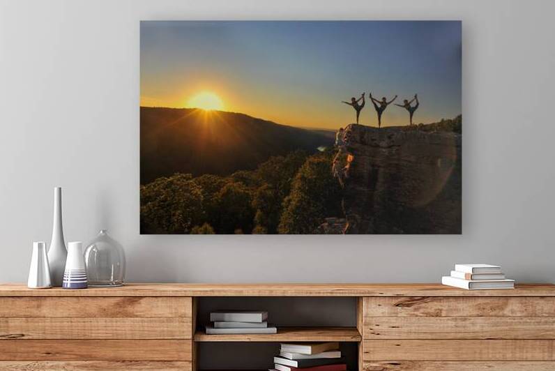 Rock Climber climbing and doing yoga by Daniel L Friend