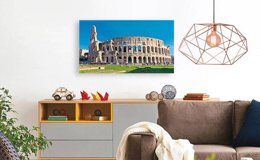 The Colosseum a famous landmark of ancient rome under a sunny sky. by IB Photography