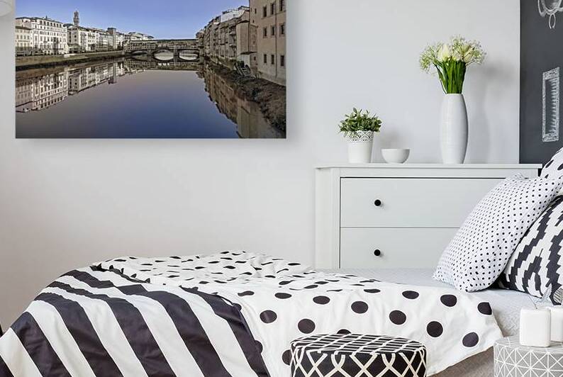 Ponte Vecchio bridge in Florence Italy beautifully reflected in the Arno rivers waters. by IB Photography