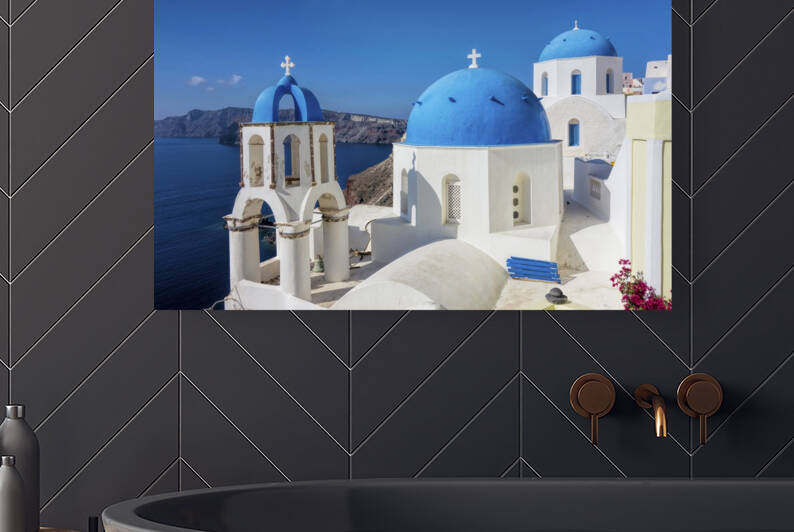 Blue-domed churches in Santorini Greece with a coastal backdrop. by IB Photography