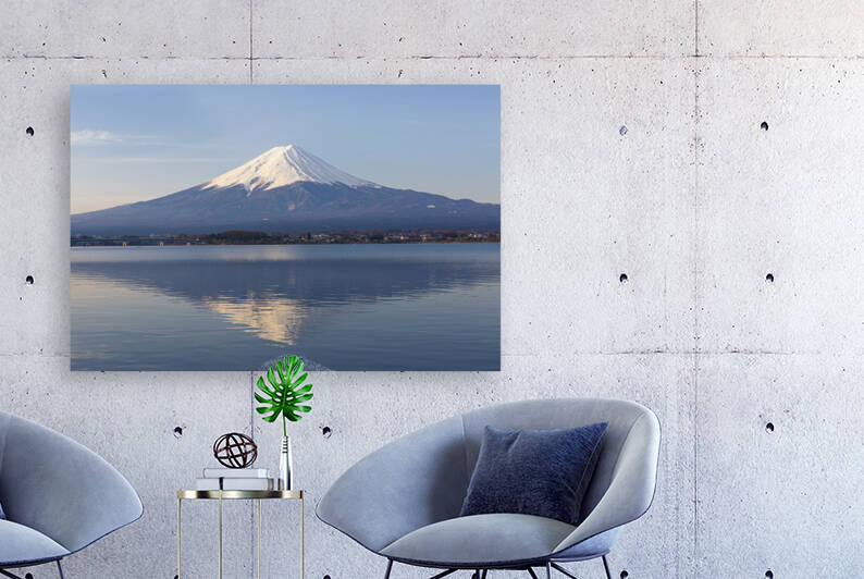 Majestic mount Fuji is perfectly reflected in the calm lake waters under a clear sky. by IB Photography