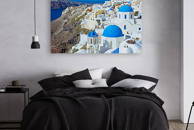 Oia village in Santorini Greece with its iconic blue-domed churches. by IB Photography