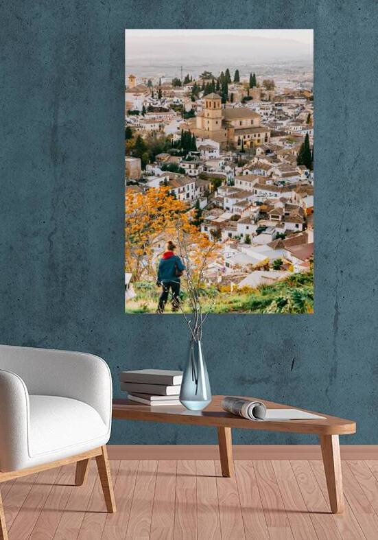 Solo wanderer walking down from Sant Miguel el Alto with layered Albaycin sunset backdrop by Cristina Taranovici