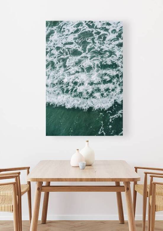 Abstract aerial view of swirling sea foam on deep green water by Cristina Taranovici