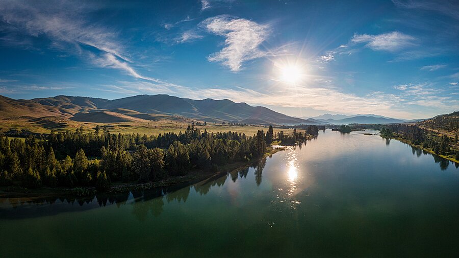Sun rising over the Flathead River Picture Frame print