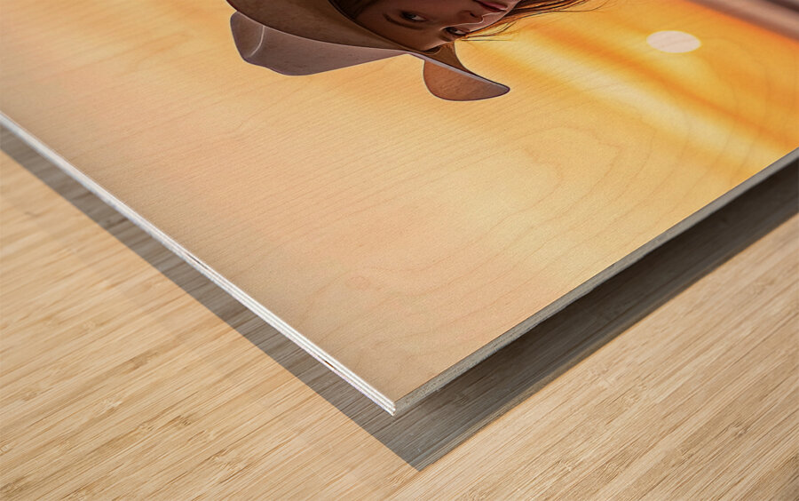 The Sunset Cowgirl Wood print