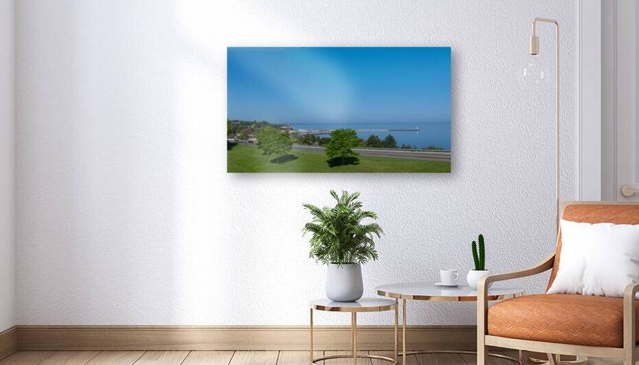 Petoskey Harbor with Light Beacon and Clear Sky by Ken Desloover