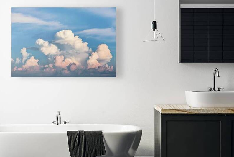 a band of clouds set against a clear blue sky 2.j by Alin Cojocaru