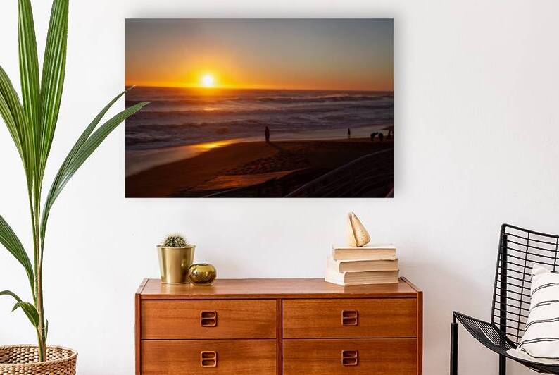 Serene Beach Sunset with Silhouetted Figures by Cristian Recabarren