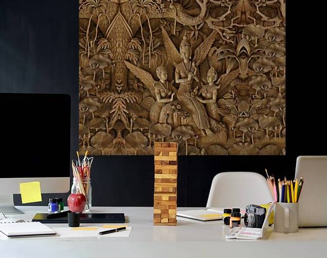 A picture of carved trees princes and boys by Nasser Ismeil