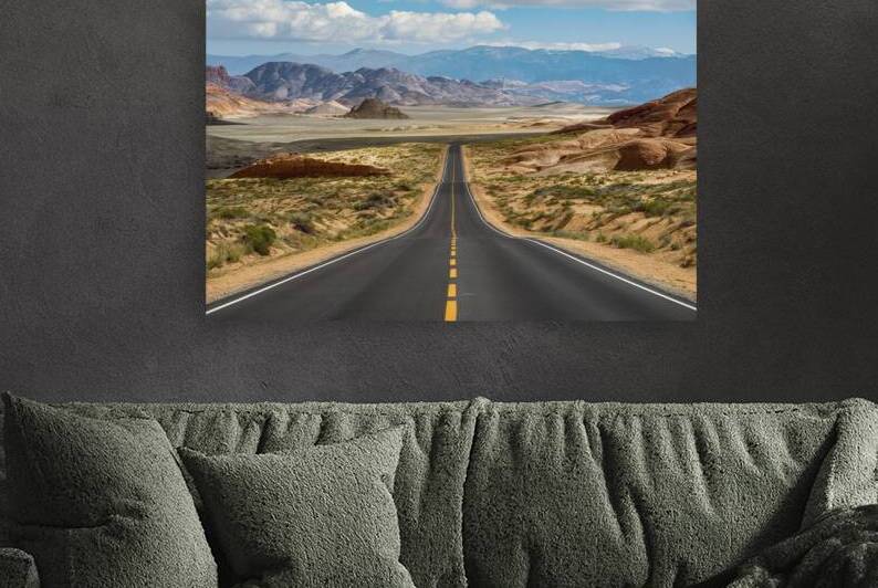 breathtaking landscape road in a desert valley ba by Liviu Ghitun