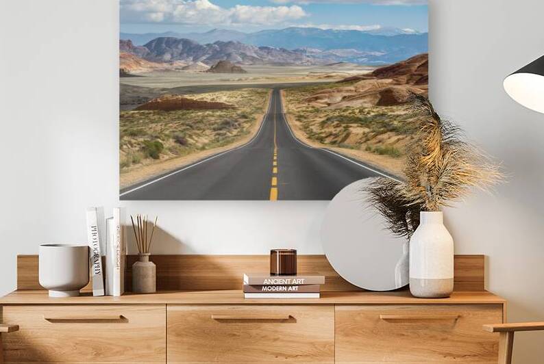 breathtaking landscape road in a desert valley ba by Liviu Ghitun