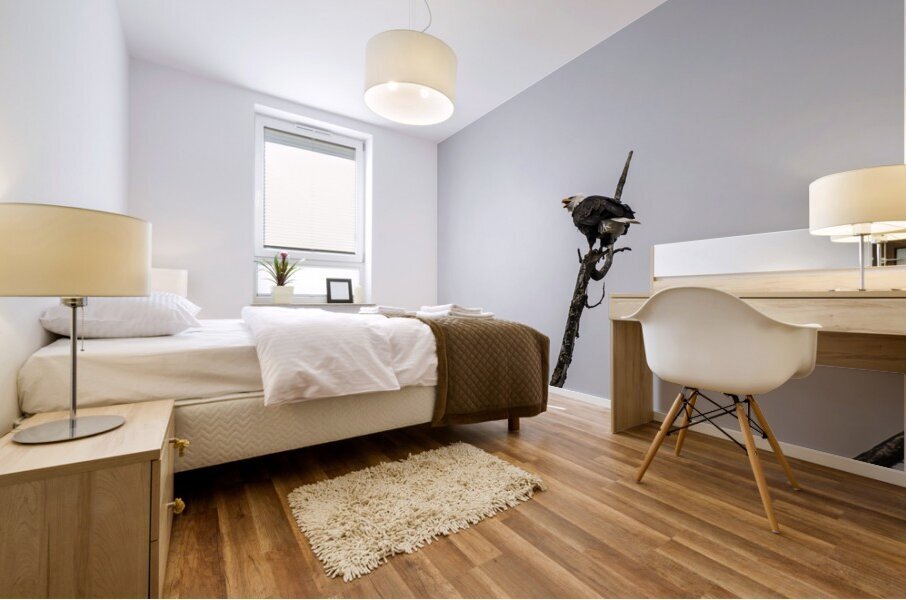 Eagle perched on top of a tree Mural print