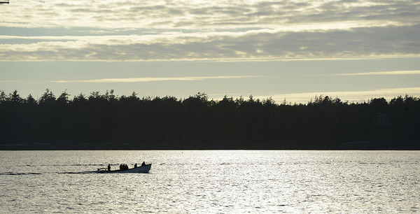 Backlit small boat coming into Tofino Digital Download