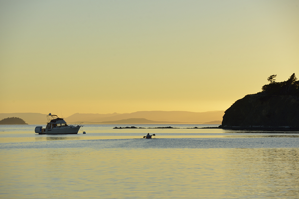Kayaker and motor boat at anchor in Fox Cove. Sucia Island Digital Download