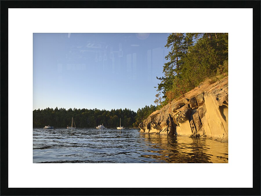 Sculpted sandstone cliff in front of the Tent Island anchorage Picture Frame print