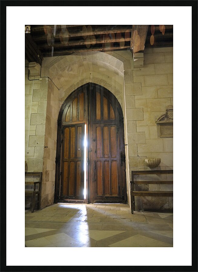 Shaft of light coming through the entrance door.  Eglise de Saint Maurice. Chatillon-sur-Loire Centre. France Picture Frame print