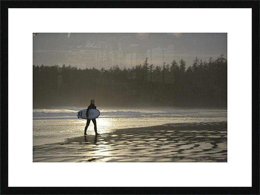 Women walking with a surfboard on Long Beach Pacific Rim National Park Picture Frame print