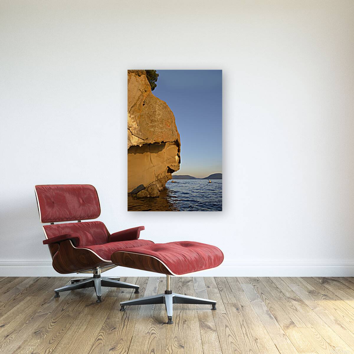 Sea kayaking under sculpted sandstone cliffs Reproduction