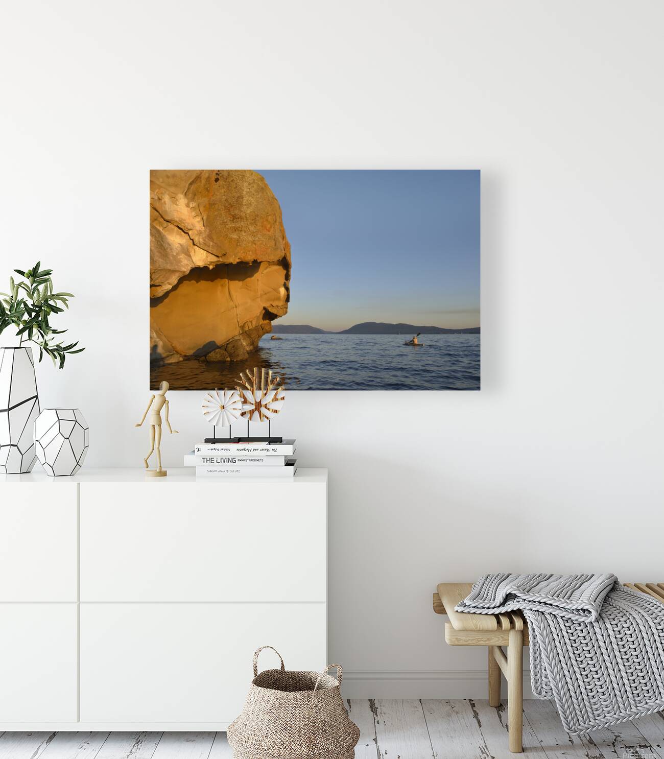 Sea kayaking under sculpted sandstone cliffs Reproduction