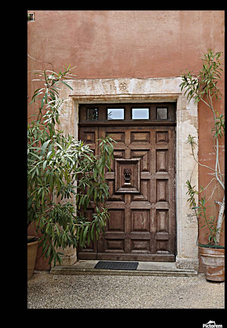 Wooden door with door knocker. Roussillon. France Reproduction