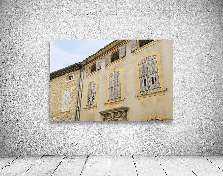 Shuttered windows on an old apartment  building in Lourmarin Wall Preview