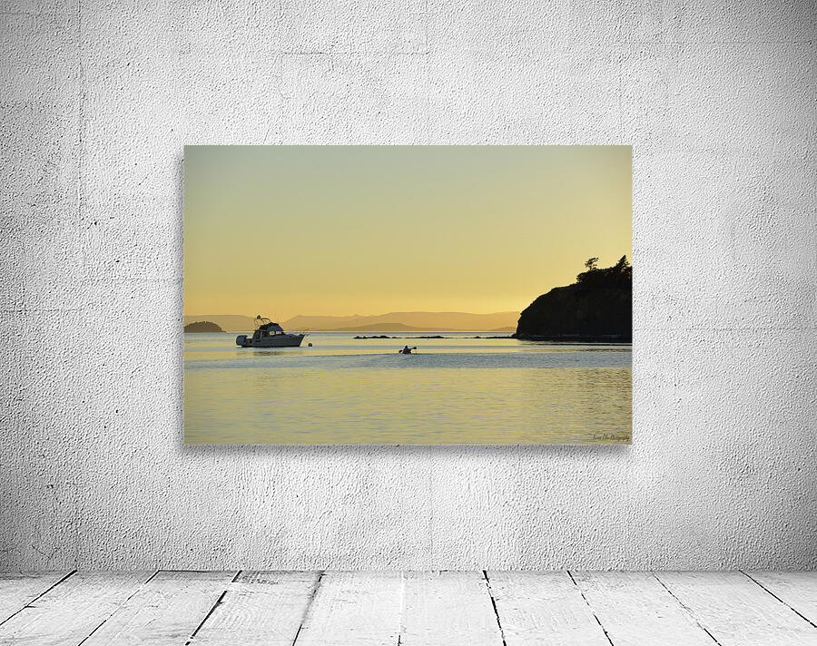 Kayaker and motor boat at anchor in Fox Cove. Sucia Island Wall Preview