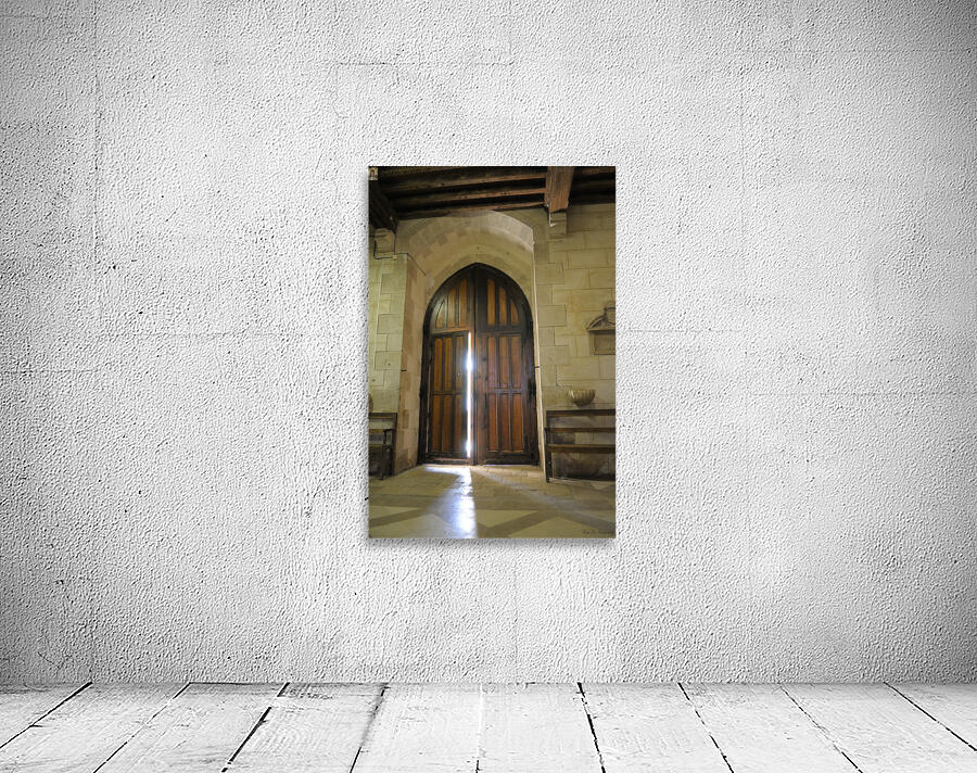 Shaft of light coming through the entrance door.  Eglise de Saint Maurice. Chatillon-sur-Loire Centre. France Wall Preview