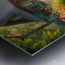 A charming cottage by a flowing stream surrounded by vibrant flowers and lush greenery evoking a fairytale atmosphere. Generative Al Metal print