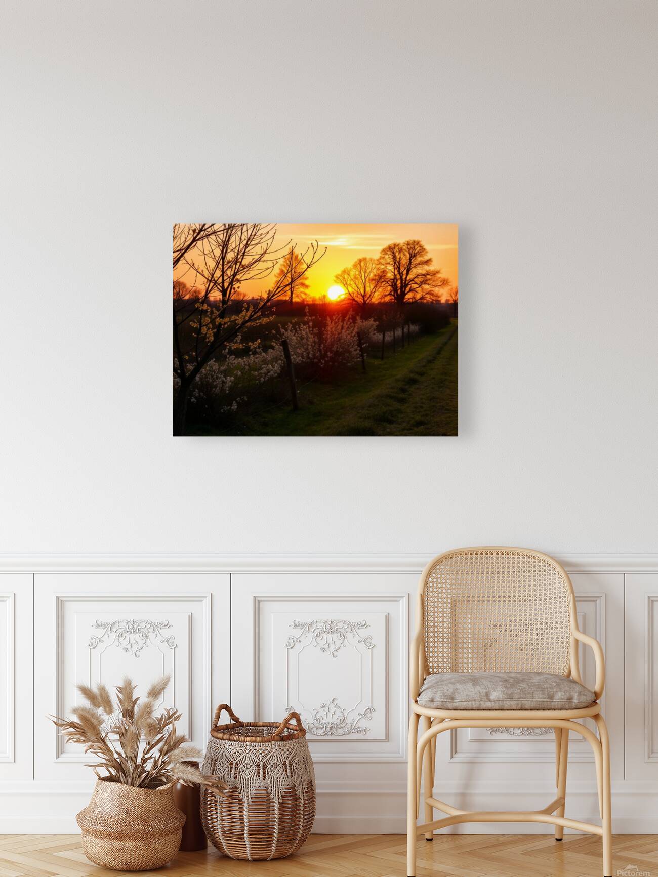  Stunning mural depicting a serene sunset over a vibrant field adorned with trees and blooming flowers. Reproduction