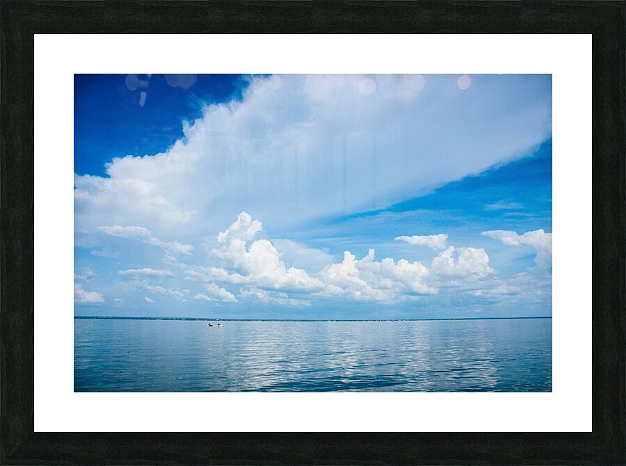 Seascape with bright blue cloudy sky. Picture Frame print