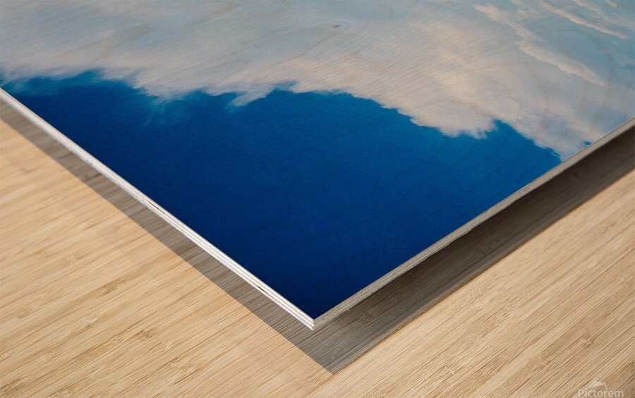 Seascape with bright blue cloudy sky. Wood print