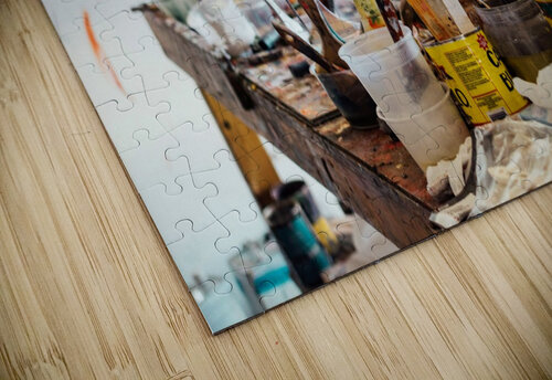 Art supplies clutter Melds Gallery puzzle