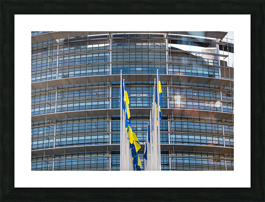Front view of Ukrainian flag flies next to the Flag of Europe in front of Parliament building Picture Frame print