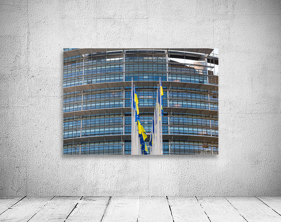 Front view of Ukrainian flag flies next to the Flag of Europe in front of Parliament building Wall Preview