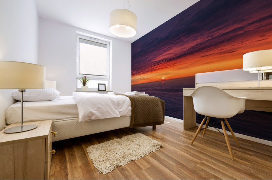 Vibrant sunset among cloud cover Mural print