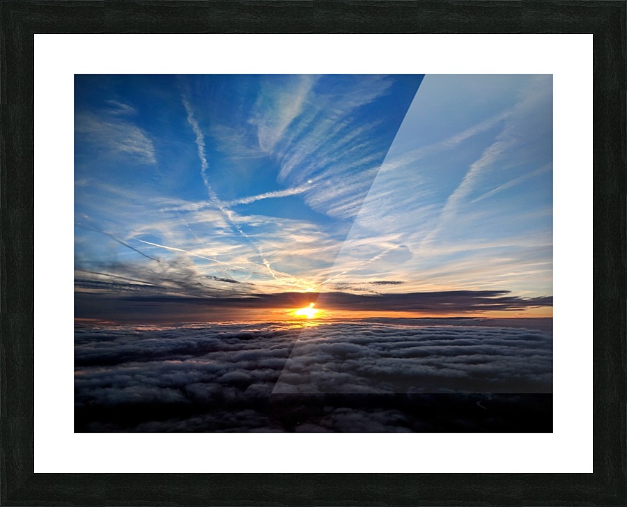 Dramatic sunset behind clouds Picture Frame print
