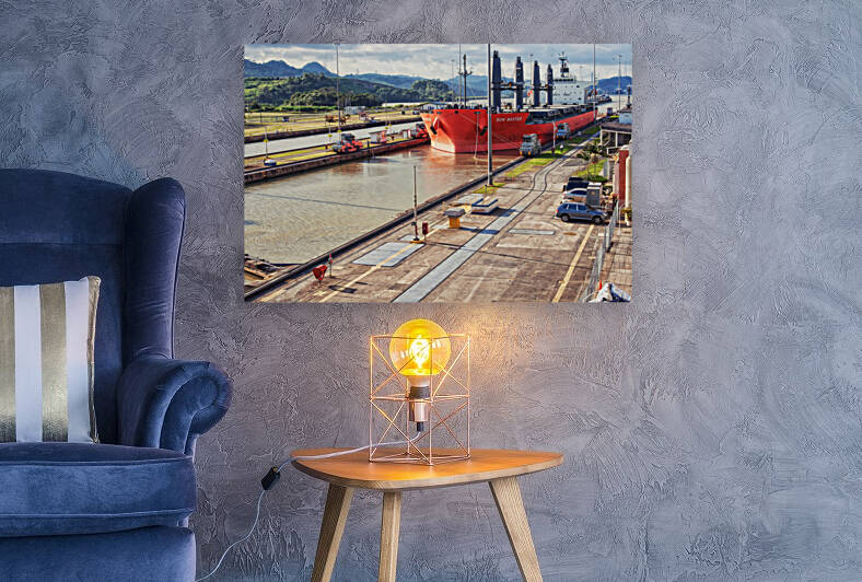 Red cargo ship crossing Panama Canal by TatianaTravelways