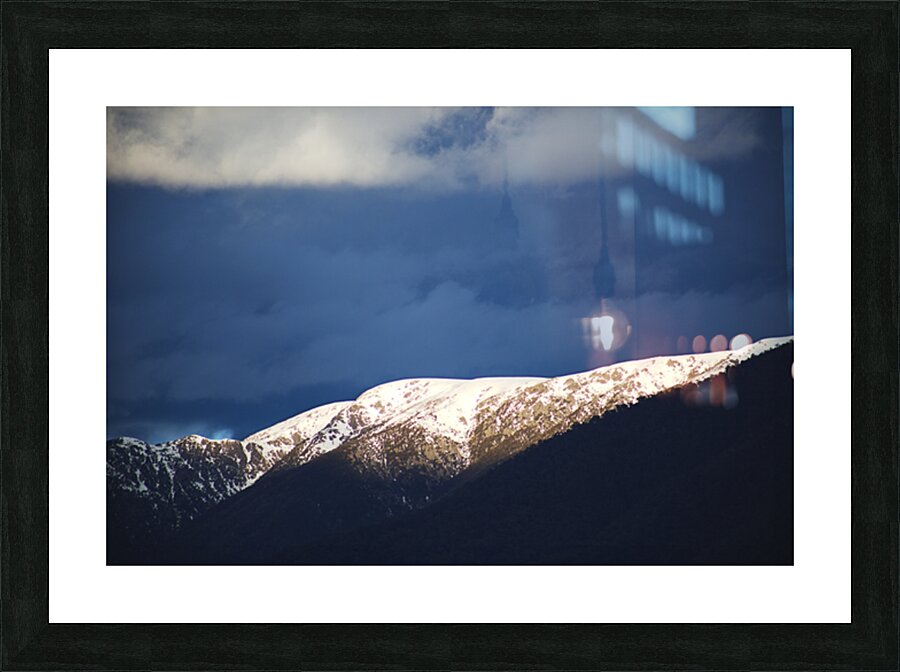 Sunlit Mountain With Dark Clouds Picture Frame print
