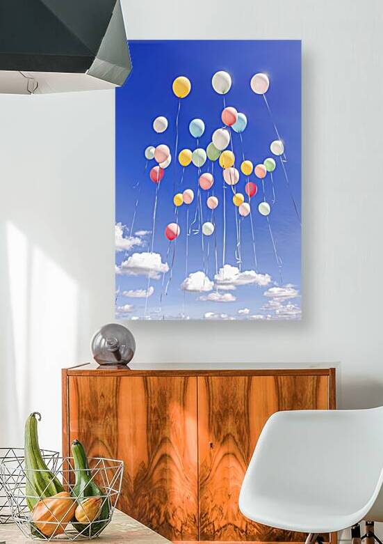 summers day with a host of coloured balloons floating into the blue sky by Lupu Andrei