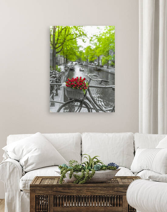 Bicycle with bunch of flowers by the canal, Amsterdam by Assaf Frank