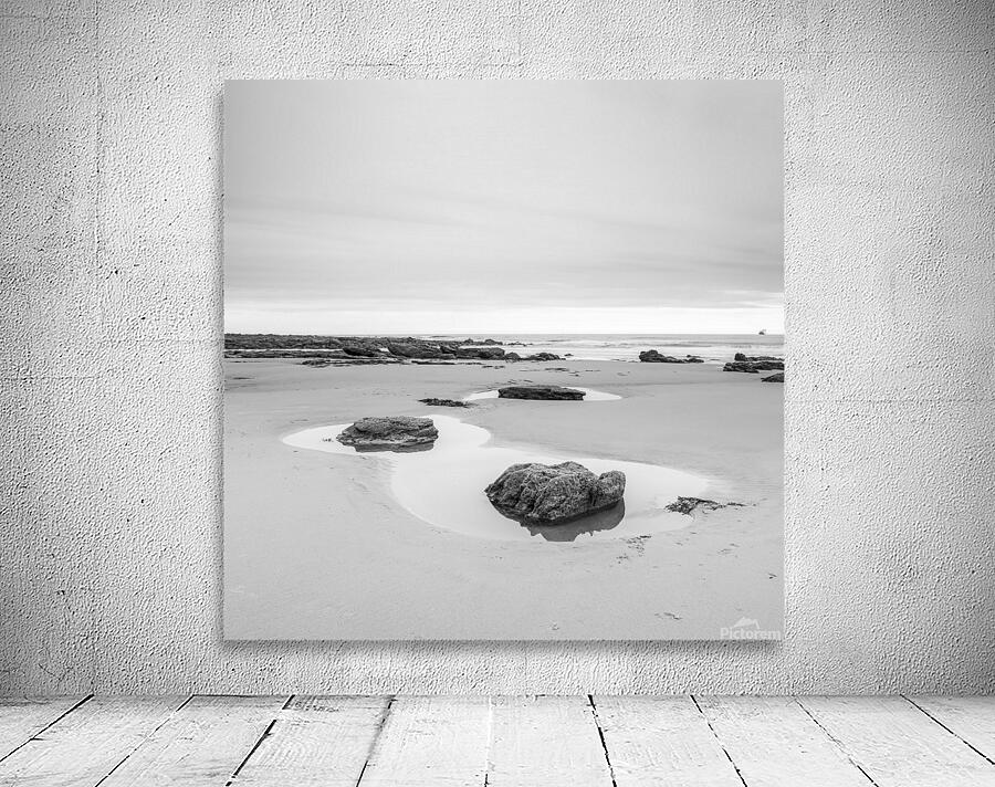Rock pools on a sandy beach Wall Preview