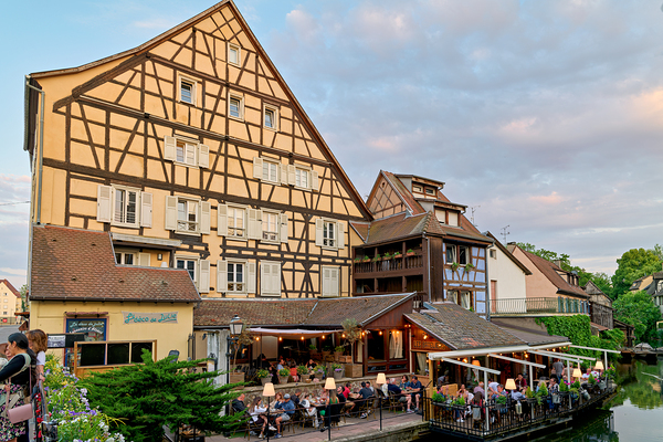 Dining by the canal in Colmar with timber framed houses in view Digital Download